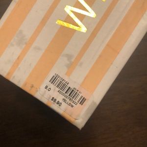 Yellow jelly sandals in a size 9.